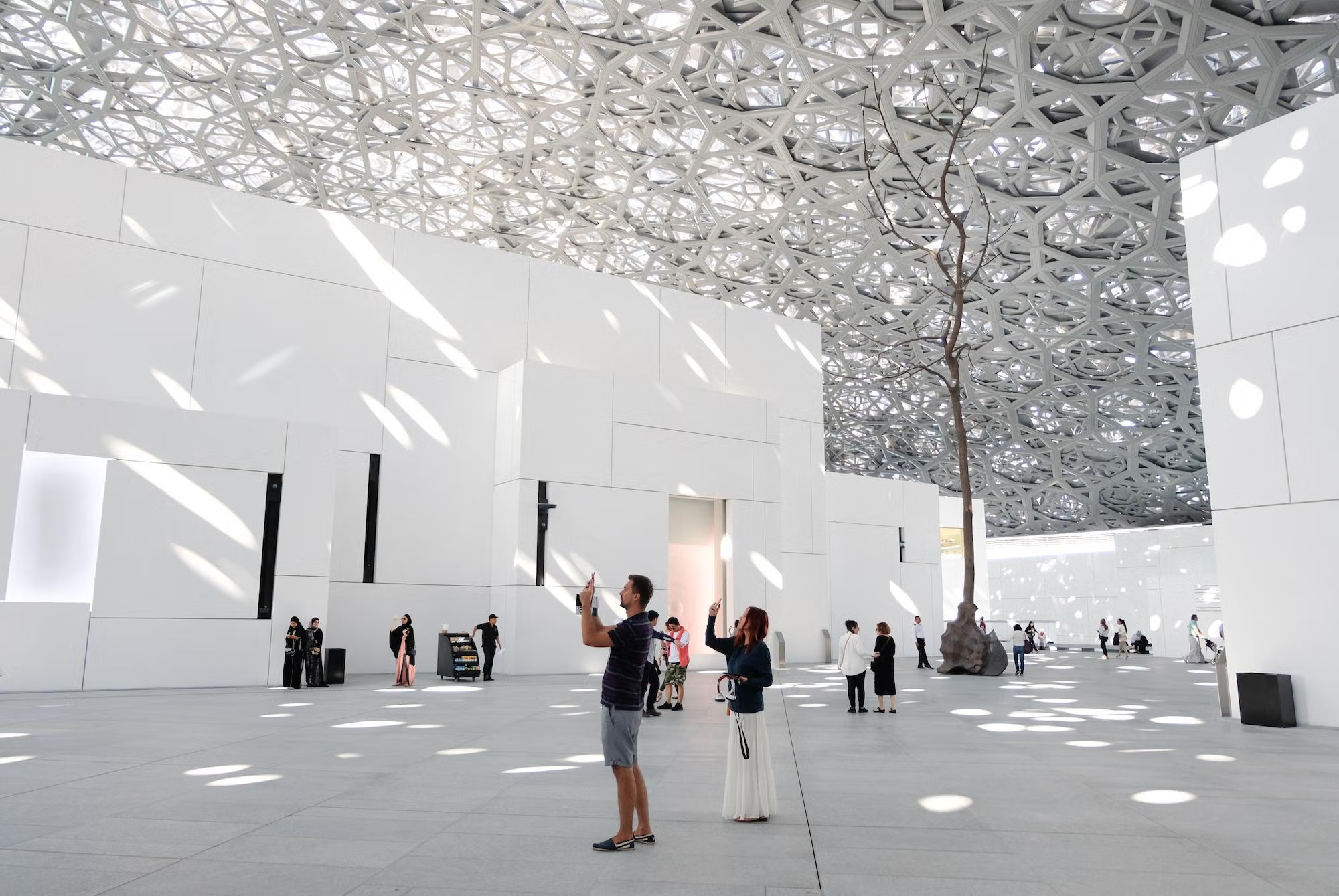 Louvre Abu Dhabi architecture by the water